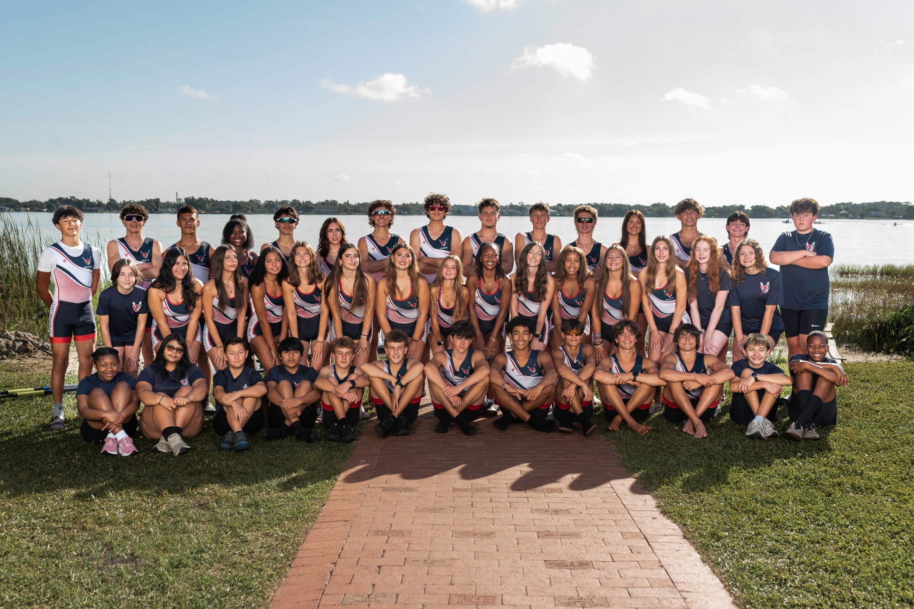 LBRA high school rowing team gathered on the shore of Lake Fairview