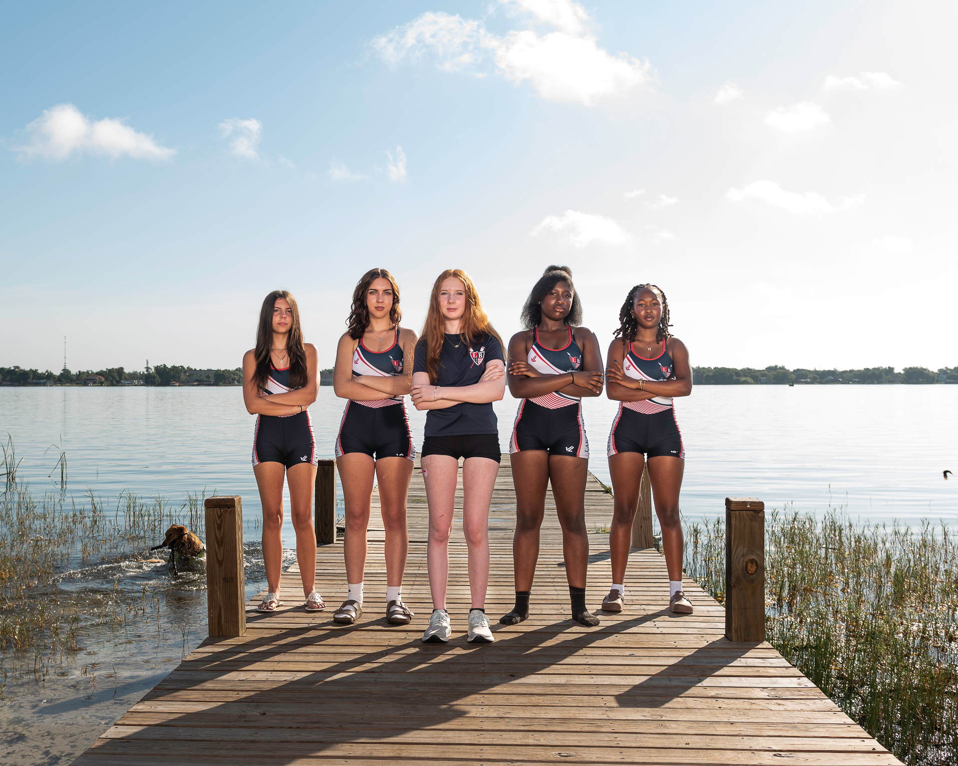 LBRA high school rowers standing on the dock at Lake Fairview