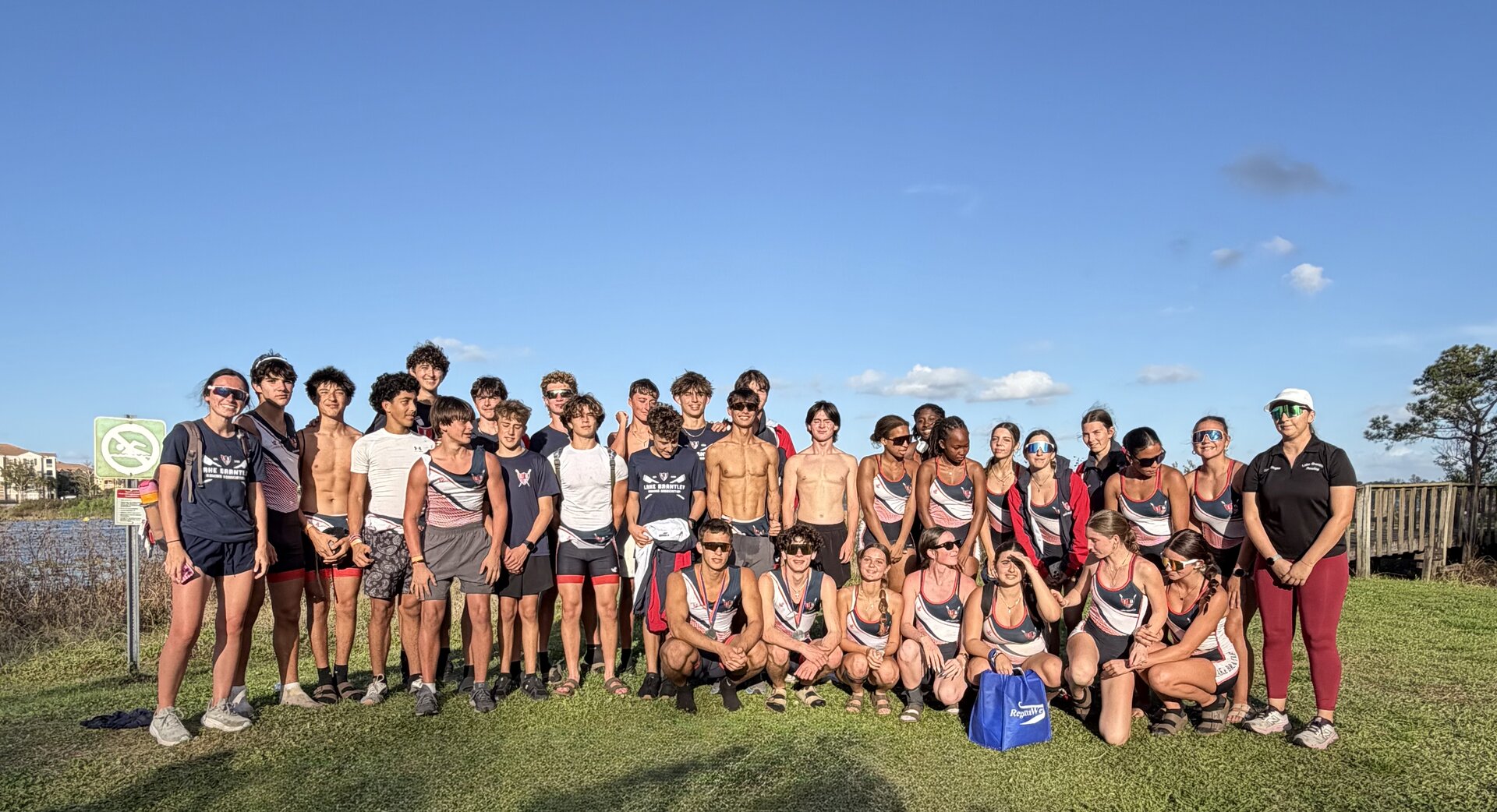 The full Lake Brantley Rowing team posed at the boathouse on Lake Fairview