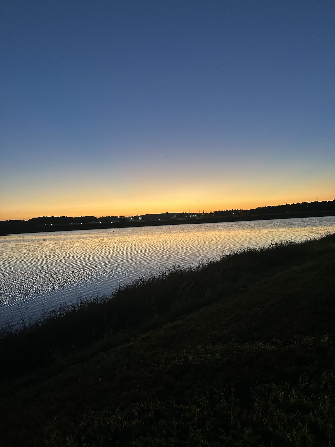 Sarasota canal at twilight with crews returning from the course